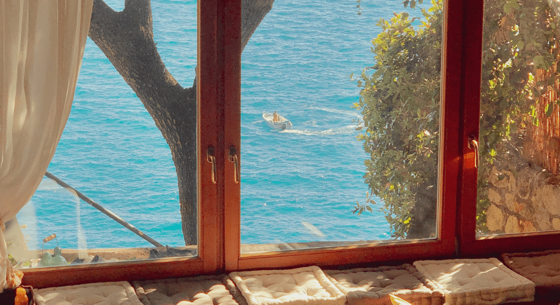 Open window overlooking turquoise sea view